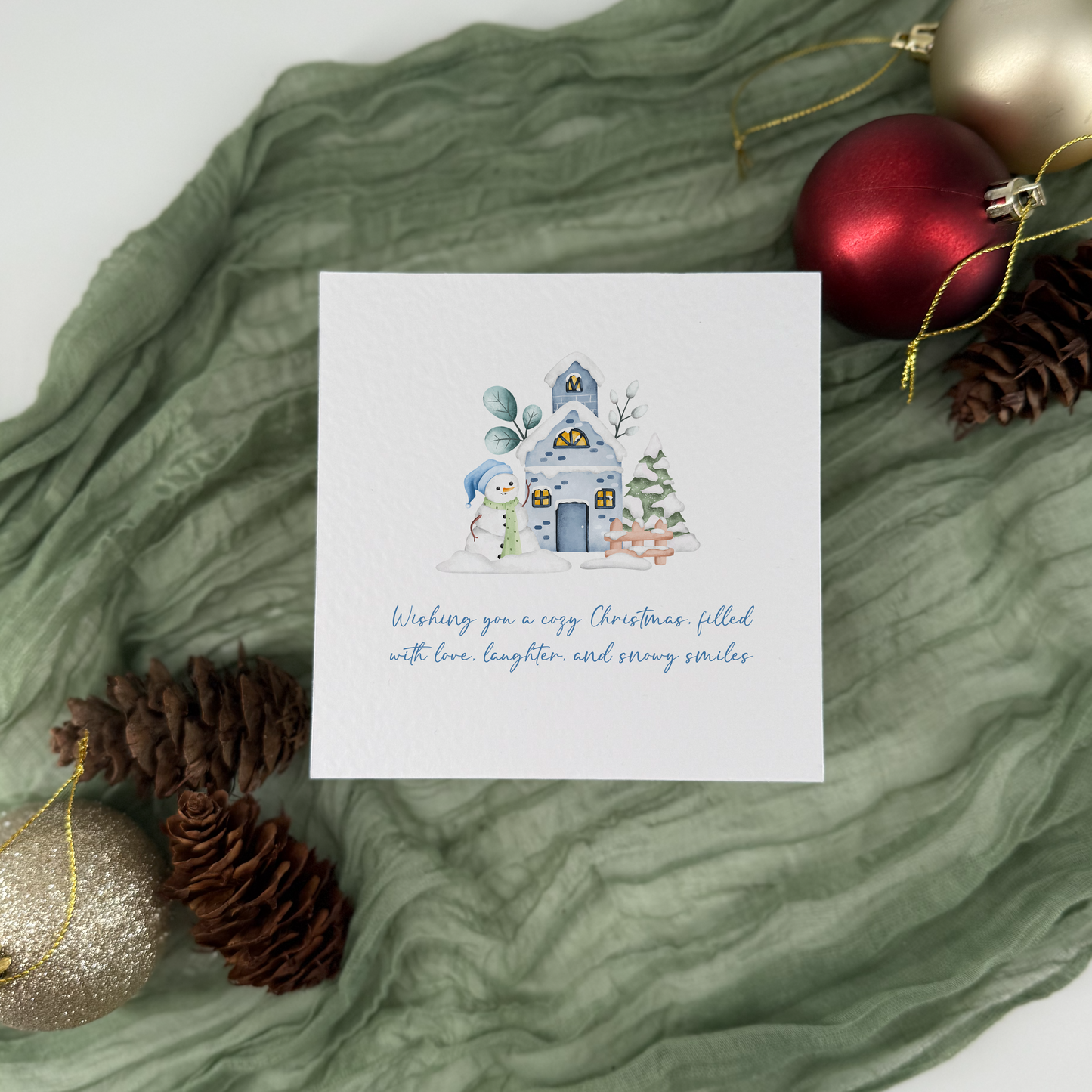 Cozy Christmas Card - Blue House & Snowman Holiday Greeting Card